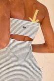 Such a cute summer dress. I love the peek a boo cut out in the back that doesn't interfere with undergarments, BUT the striping on the fabric doesn't line up properly at the seams. Specifically the seam at the top that loops over the elastic at the bust line. You can actually see what I mean if you zoom in on the pic of the model's back & it's not a huge deal, but it cheapens the look. - Christy M.