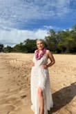 I normally wear an XL but it was to tight it wouldn't zip up so I up sizes to 1X and it was to big on the breast area. But overall the dress was beautiful I was able to hide any imperfections with my lei necklace. It was the perfect dress for my vow renewal. Oh and it has a one piece bodysuit thing going on underneath fyi - Adriana C.