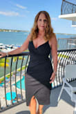 The dress is a nice thick quality. Fits very well on my hourglass shape. Did not even need an undergarment and usually, I struggle with having bumps. Wore it to a wedding and was getting so many positive comments. Definitely am going to buy it in red. Great quality and reasonably priced. Really glad I found this dress. - Lisa L.