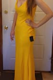 The material is great. Its double layered and color is beautiful!
I'm 5'8 and it's long on me. Prepare to wear heels or get it altered. - Olivia S.