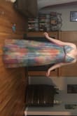 The colors are less "watercolor pastel" and more "1970s tie dye". I got this dress to wear to a formal wedding and the bright colors definitely made it less classy. The slits, as others have mentioned, are SO HIGH. I'm 5'11 and they went PAST my underwear! I have no idea who this dress is made for. On the other hand it was long enough for me! It was actually really fun to wear but not suited for the wedding. I ordered an L (the largest available) and the back wouldn't zip all the way. The spaghetti straps were so tight they cut into my skin in a really unflattering way... I this this dress is better suited for people with a more narrow frame. It was decent quality but not fitted for my occasion or my body. - Stephanie B.