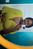 I believe this is the perfect crop for me and my boobs! Haha. The shirt is the exact color, and it's so cute! I am a 38ddd and bought an xl top and instead of tying it in the front, I tied it in the back and the back of the shirt covered it. - Kristin F.