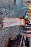 This romper is so comfy!  I'm 5'3 so it went all the way to my ankles the tie in the back gives you room to adjust according.   I loved it and it has POCKETS!! - Jimena R.