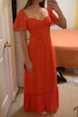 The dress is stunning and requires no alterations. The color is slightly more orange and less pink, but still beautiful and bright. - Lauren H.