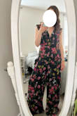 The print on this jumpsuit is so much cuter in person. I ordered a size medium (I'm normally between a small/medium) and it was way too big (in the waist and length wise). The material is also thicker than expected, the lining on the legs would definitely keep some heat in - not ideal for the June wedding I had planned to wear this to. There's also a weird, strong polyester smell that I hope would come out after washing, but since I'm returning I can't confirm! This jumpsuit had so much potential, but just didn't work for me. - Meagan H.