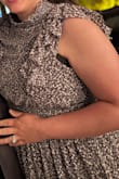 I ordered this dress to wear as a guest to a wedding. I ordered an XL thinking I would need the extra room being 6 weeks postpartum, but wished I had ordered a L. The top was extremely big on me. It was too late to return because I needed it for the upcoming weekend. The left arm hole had to be pinned with safety pins as a last ditch effort to keep my bra from showing. The right arm hole seemed okay. Wouldn't order again or recommend. (Photo is even after the hole was pinned.) - Kelly M.