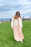 This was a nice dress to wear as a wedding guest. I had to use fashion tape to make the upper part stay on my chest area and I had to get it altered 4" shorter so that it wouldn't be too long with or without heels. My heels were 4". But this dress is lovely. - Kimberly G.