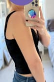 This is a good basic crop top. It is pretty tight-fitting, but the material is stretchy. You could size up depending on how tight you want it to be and the shoulder strap length isn't adjustable. It hits a bit lower than other crop tops, so it could work with high-waisted or more mid-waisted pants, etc. The lengths of the straps are pretty small, and it sits up pretty high under the armpit. It is isn't really sheer and can be worn without a bra (especially if you're smaller-chested like me). - Stephanie L.