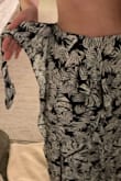 This is the perfect summer wrap. It actually zips closed on the side for a secure fit but the option to tie the twist as well for the look. - Emily K.
