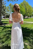 I love this dress! It's so cute and the seams throughout the bust were very flattering and not uncomfortable. It was the perfect length for my heels, it didn't need any alterations. The slight floral pattern of the fabric and the sleeves made this right dress appear a bit more modest! - Leyna W.