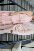 I got it medium to be on the safe side but I'm sure small will fit as well. Very loose and comfortable. Send it to the press and will look like a million-dollar dress. - Gilenid R.
