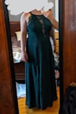 I really should have been a size L, but they were out, so I got an XL. It actually fits very nicely - just a little loose on the top. I'll add a few safety pins on the day of the event.
The top of the dress is not structured (I wish it was!) A bra would show through the lace, so I plan to tape my boobs.
As others have noted, all Lulus dresses come VERY long-like, made for a 6-foot-tall person! If you're not that tall, just plan on tailoring it to the right length. Easier to make it shorter than longer. :p
This photo was taken after I cut 6" off the length, and I'm wearing 2" heels. Note for those who plan to DIY the tailoring: because the outer fabric and the lining are different sizes, you'll need to hem them separately. - Laurel H.
