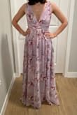 This dress is super romantic and beautiful. I was a little worried about the slit but it's honestly not that noticeable. It just makes the dress more breathable. It is a little tight where it clasps under the bust for me but because it fits so perfectly everywhere else I'm going to make it work. - Ali G.