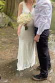 I wore it for an outdoor ceremony. The fabric is soft and stretchy making it comfy to wear, the lace gives it a delicate and feminine touch. I love that it hugged all my curves and hid my belly bump. Although it could have been hemmed if I had enough time, I just wore some boots and didn't mind it dragging on the ground a bit. I chose this over three other styles since the price, comfort, and style was perfect for me. - Patricia P.