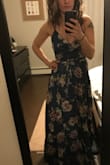 I absolutely LOVE this dress! It's great for someone small chested (I recommend sizing down - medium was also comfortable in the waist but too big in the chest). Definitely do the recommended sizing with your bra size to find the right one for you (the waist doesn't matter so much in this one). There is lots of fabric so the slit is not obvious unless you want it to be, super flowy and nice quality - it's a heavier fabric so more formal than just a sundress. - Diana I.