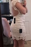 I like this dress a lot. The only thing I find [an] issue with is the arm pit/under arm area is a little loose, I assume because there is obviously no fabric in the back. I will have to safety pin in order to avoid a bulk look in that area/bust area. The attached photo isn't the best, but you can see the loose area. The lacey overlay is delicate as to be expected, easily snags but the dress fits nicely and it is very pretty! I love the open back. A little difficult finding shape wear with a backless bra cut that low. Overall love the dress and can't beat the price. - Becky L.