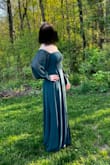 I bought this dress for prom. It's so beautiful yet simple! It was too long, but I expected that. I also wish the slit was not so high, but otherwise, I loved it! The color is stunning. - Ellery M.