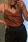 The down side is this shirt does not look silky in person, but the upside is it looks about as good on me as it does on the model so I'm going to keep this around for wedding season this Summer. Not bad. - Kelly R.