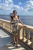 I wore this to 2 weddings this year because I loved it that much. I got so many compliments on it and it was so pretty and different. I got a Small and it wasn't too tight but also form flattering. Highly recommend if you like to wear a more different or stand out dress! - Bailey H.