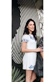 This dress is simple but so cute. I love the detailed embroidery, the blue stands out perfectly against the white clean look. Although it's a relaxed fit, it looks great. I love this dress! - Auria H.