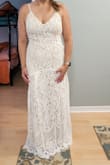 My wedding is not until July and I can't wait to wear this dress. It hugs your body in all the right places. It's light and airy; perfect for my summer wedding. My favorite part is the small train and the detail of the fabric. I'm 5'7 and the length is just right to wear it with 2" heels. - Gina M.