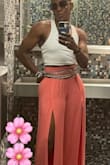 These beautiful pants are so flattering and sexy! I caught many people by surprise whenever I stood up from a seated position and nearly my entire leg pops! The material could be a tad thicker, however, it's not see-through at all.  I will def be purchasing the other color! - Alisa M.