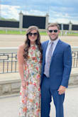 I absolutely love this dress. The colors are even better IRL. I selected that the fit is slightly small, but really only the zipper portion near my rib cage. It zipped fine but was a tad tight. I would not have sized up as it fit perfectly everywhere else. 
I wore this dress to an outdoor wedding and received so many compliments! - Lindsey C.