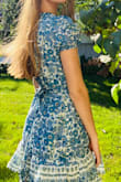 I love this dress, the print, [and] the cut are great. I'm tall so it is short but not too bad - Dev G.