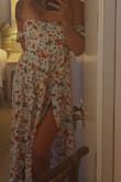I'm obsessed with this dress! Fit is true to size. The details are amazing, the buttons on the chest, side cutouts, and the arm pieces, all really make this dress. It flows elegantly. Tons of compliments. - Emily
