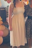 This dress was perfect for my bridal shower! It was comfortable, kind of modest but also stylish. I was pleasantly surprised with the midi length. My only complaint is that the straps did fall down somewhat easily despite adjusting them. - Maddy S.