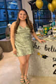 Got many compliments on this dress for my graduation party! The material is nice, not stretchy at all though. I'm typically a small & got a medium for this dress. I will say that the dress is pretty short (I'm 5'0) so I'd be aware of that. Overall I love it! - Yasmine M.