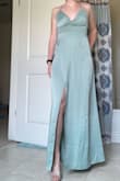 The green is really pretty, it's not as shiny in person but still decent quality. It's definitely a little tight around the ribs, I probably could have sized up to a medium but it will do. It also just barely hits the ground without shoes on. Overall satisfied with it! - Jennifer L.