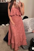 I'm always worried about strapless but it doesn't slide at all! It is a tad snug but not uncomfortable! Super cute and more lightweight than I imagined, in a good way. - Chloe L.