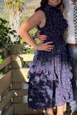 The dress is very comfortable and flattering. I got a medium and it was a little loose around the neck area but I don't think I would get a smaller size. The rest of the dress fit pretty well, wasn't super tight. - Jessica D.