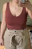 It's a little tight but not terrible - the fabric is very comfortable and I love this burnt orange color - Ann H.