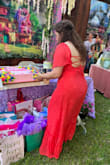 Love the dress, the combination of the backless and bell sleeve make it very elegant. Color was vibrant and perfect for my ocasión. - Maria S.