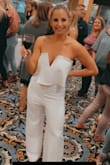 It fits nicely in my body. Hits my curves nicely and it's a nice thick material, yet stretchy. It does run pretty long. I'm having it hemmed. It's probably 5-6 inches too long for me. (I put on 4 in heels and it was still too long!) Nothing a hem can't fix. I don't have to wear a bra with this. - Sarah A.
