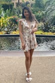 This romper is gorgeous as long as there are no Nip Slips!!
Tips- really tie the back of it tight and keep a semi-decent GOOD POSTURE. If you're sitting or slouching one strange way, the shoulder might slip off. It's a real fear. Wearing a sweater over it will save you in the car and help keep the sleeves up.
It is gorgeous though. Totally worth. Once I got the hang of how to wear it, I got sooo many compliments. Im looking at these pics like wow- stunning >)
I got an XSmall. Fits well and I'm really glad I didn't size up. - Laura D.