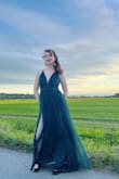 My daughter wore this to prom, it was exactly what she wanted. It was extremely good quality for the price. The slits are pretty high but it was a good look overall. - Jen W.