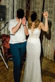 This dress is pure magic. I ordered a few other dresses from Lulus, but the second I saw this one I knew it was IT. I received a thousand compliments on it before and on my wedding day, and was thrilled with my purchase. It is insane that this dress is only $300, because it looks like something I paid way more for. 

I'm normally a size 6, but I had lost a little bit of weight and thought maybe a 4 might fit. But I ordered the 6 just in case - because I knew this dress might go fast online and 6 is the more common size - and instead had the back taken in an inch or so it fit even better. Also, since I'm so tall and wore 2.25" block heels with it, I did't even need to have the bottom tailored. 

I thought the lack of liner on the inside top would be an issue for photos, but it really wasn't. The glitter will get everywhere, but for me, it did't really matter. It's not that noticeable. If this bad boy is back on the website, snatch it up fast! Truly the best Lulus purchase I've ever made. - Kimberly K.