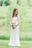 I can't rave about this dress enough! It is more beautiful than any over-priced bridal gown I could've purchased at a bridal store. With this dress, you don't have to waste time (and money) with a bustle, but it still has beautiful flowy material at the bottom to give it a bridal flair.
I'm 5'11" and wore flats, so I didn't have to make any alterations. It fit like a dream and I gelt beautiful in it. Thank you, Lulus! - Jenna B.