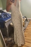 I immediately felt not only pretty but comfortable in tbis dress which is something people forget about. I don't really need any alterations but I may cut off the strings in the back. it is a little bit more cream colored than white just for anyone wondering. I plan to wear it on my day and tried many others and this surprised me! - Rebecca H.