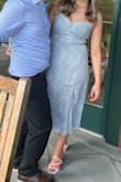 I went back and forth with this dress as I'm always dealing with my wider hips but I'm so glad I chose it. It's a true US medium so don't size up!! I'm a 6-10 and medium was perfect. I'm so glad I went with this dress for a wedding. It has the perfect amount of detail for a timeless look but isn't overly fancy. I attended a brunch wedding as part of the family and it fits that role perfectly - Devon F.