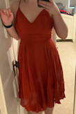 This dress was very comfortable and flattering, but it definitely takes a second person to lace you into it. Also the color is more rusty orange than peach as it looks in the photos online.
PS to Lulus: your rules for photo width and size make it very difficult to upload photos taken on a mobile device. Please change this!! - Deborah H.