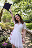Super cute graduation dress. I normally wear an XS or S but I ordered the XS in the dress. It was a tiny bit tight around my waist but not enough for me to want the larger size. It held me in great and was not see-through at all. The lace details are more of a thick crochet which I loved. Highly recommended! - Amanda G.