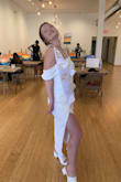 I got a lot of compliments and the dress is pretty, but I felt like the slit could get way too high when I squat a little or step too far. Also I have a bruise on my arm from the sleeve fabric, it is not tight at all when your arm is resting but it is immediately tight when you lift up your arm. - Liz B.
