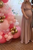 Loved this dress, but according to the size guide, I should have ordered a medium. I went with a small and honestly, could have worn an extra small! My normal weight is 130, but I'm currently 150 and 8.5 months pregnant.. the dress fit well overall, but the top and shoulders were very loose and I had to tape it to my skin or else the shoulders would fall right off of me. - Jackie M.