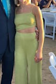 The fabric is super comfortable and I loved the style of this jumpsuit. I had to get it hemmed but I also had to get the waist taken in. I wish Lulus would stock more items in XXS, because I think that would have been perfect. The color is darker in person, less like/neon looking than the picture. - Alyssa P.