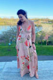 I am not a pink girl... ever, but for a spring wedding I went to this was perfect. The red, green, and white floral pattern broke up the pink enough for me and I ended up loving the color. The fabric was soft and light and would blow behind me as I walked, I felt like a model! I got so many compliments, one woman even said I had the best dress at the wedding, then quickly corrected herself to say after the Bride of course! haha
For me it was a little tight around my waist, I got a medium and just barely got the zipper up. But I think I would've had to get a Large tailored. I wore short heels and the length was perfect. A win for us tall girls! Highly recommend this dress. - Alex H.
