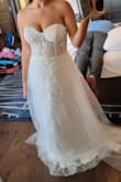 Made me feel like a princess. Loved the extra layer part in the back and the detail on the dress is gorgeous. The sheer bustier adds just the right amount of sexy without going overboard. No bra needed! - Lany K.